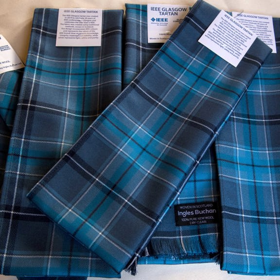 Blue toned tartan scarves and ties with IEEE Glasgow Tartan and  Ingles Buchan labels