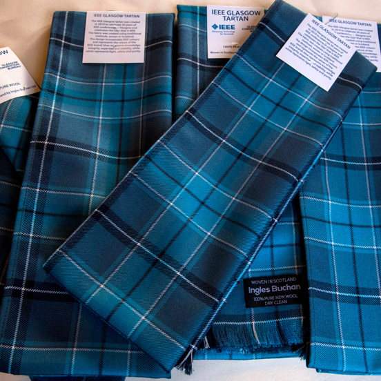 Blue toned tartan scarves and ties with IEEE Glasgow Tartan and  Ingles Buchan labels