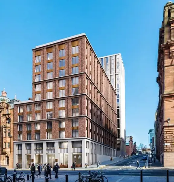 Image shows a digital render of the external view of the AC by Marriott Hotel. A multi-storey stone and brick building on a sunny day..